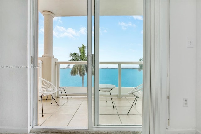 balcony featuring a water view