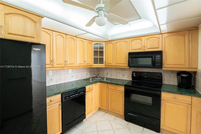 kitchen featuring black appliances, light brown cabinetry, light tile patterned floors, sink, and backsplash