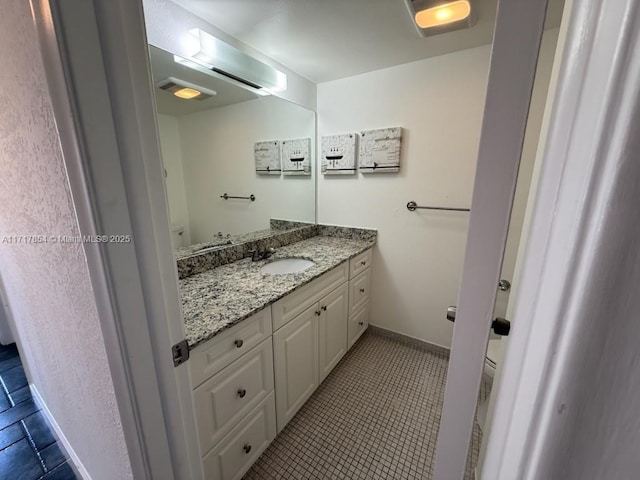 bathroom with tile patterned floors, toilet, and vanity