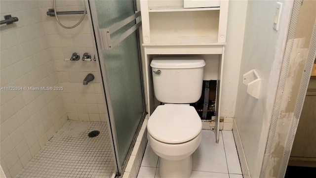 bathroom featuring toilet, walk in shower, and tile patterned flooring