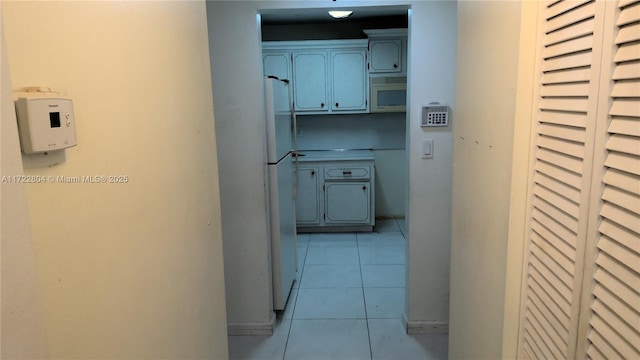 hallway featuring light tile patterned flooring