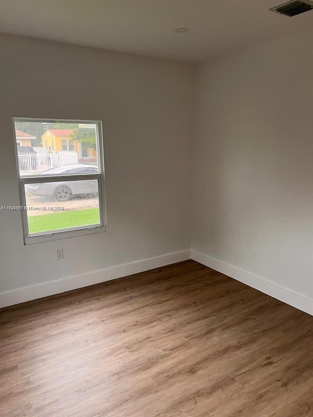 spare room with light hardwood / wood-style floors