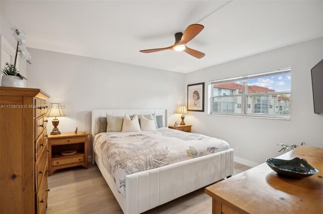 bedroom featuring ceiling fan and light hardwood / wood-style flooring