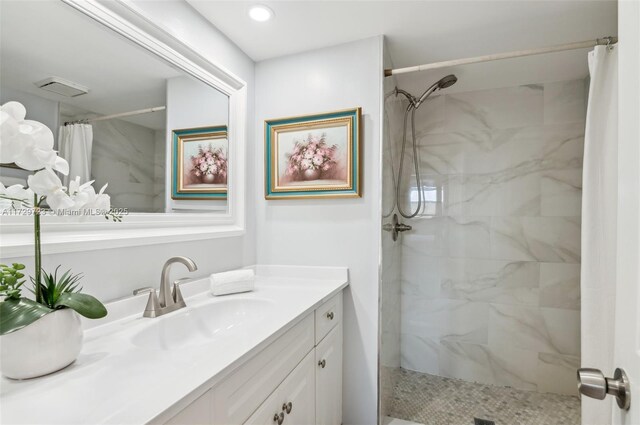 bathroom featuring vanity and a shower with shower curtain