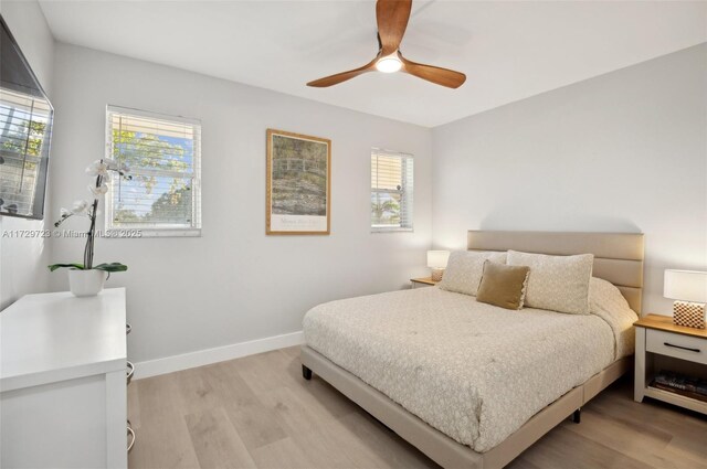 bedroom featuring ceiling fan and light hardwood / wood-style floors