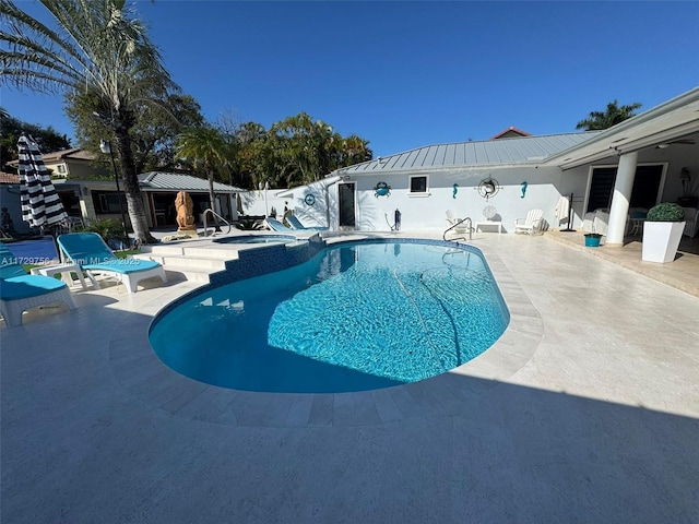 view of pool with a patio and a gazebo