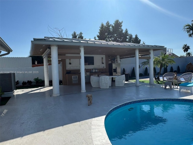 view of pool featuring a patio