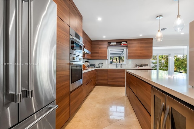 13100 Keystone Ter, North Miami, FL 33181 - kitchen featuring stainless steel appliances, modern cabinets, brown cabinets, wine cooler, and light countertops