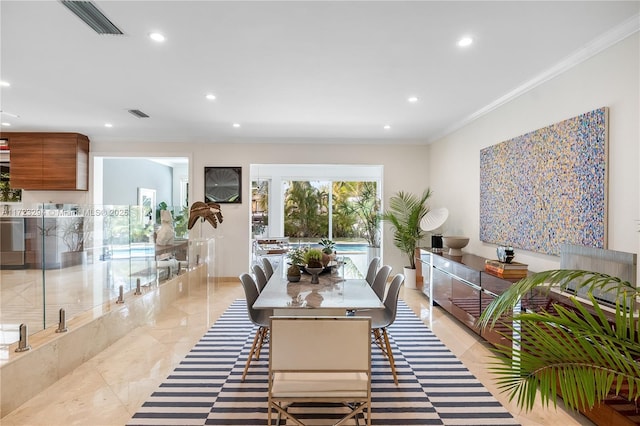 dining room featuring ornamental molding