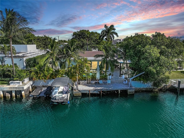 aerial view at dusk with a water view