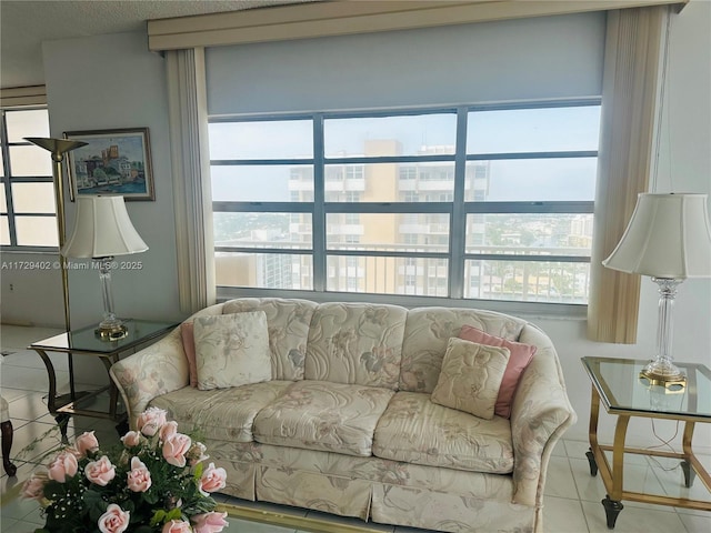 living room with tile patterned floors