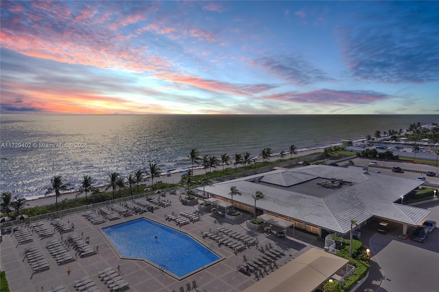 aerial view at dusk with a water view