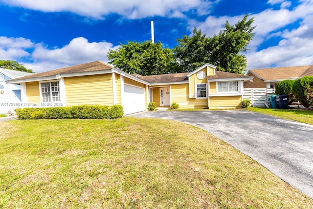 ranch-style home with a garage and a front yard