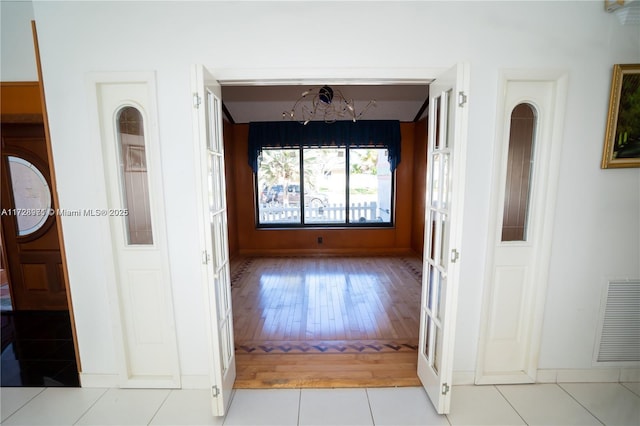 hallway featuring light tile patterned floors