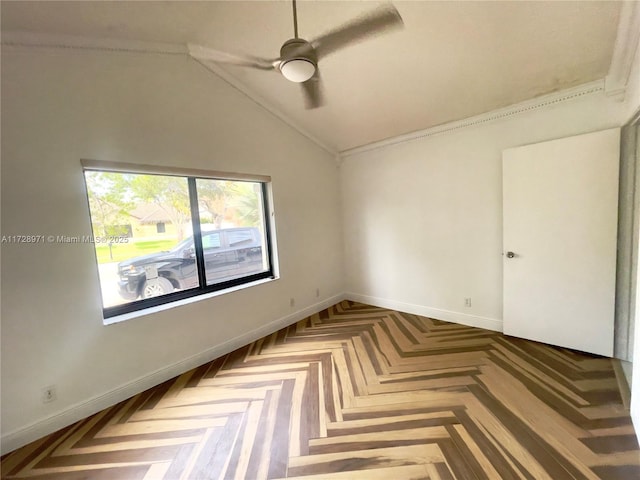 spare room featuring lofted ceiling, parquet floors, ceiling fan, and ornamental molding