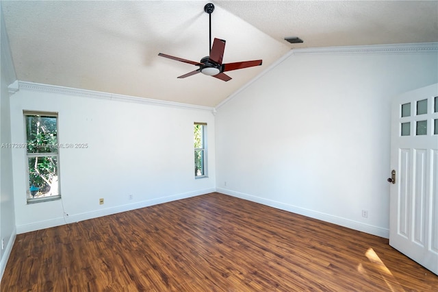 unfurnished room with ceiling fan, dark hardwood / wood-style flooring, ornamental molding, and vaulted ceiling