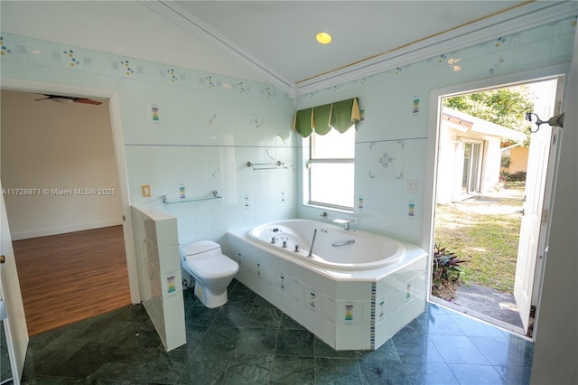 bathroom featuring toilet, tiled tub, tile patterned floors, ornamental molding, and lofted ceiling