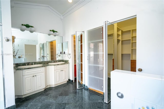 bathroom with vanity and ornamental molding