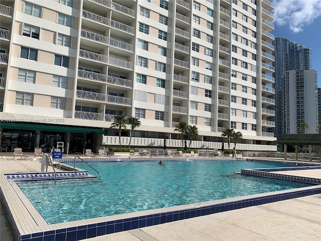 view of swimming pool featuring a patio area