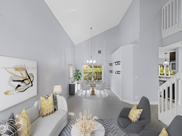 living room featuring a notable chandelier, high vaulted ceiling, and tile patterned flooring