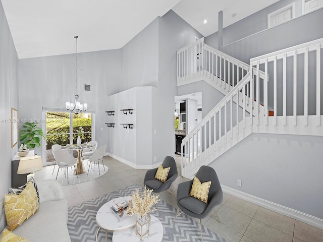 living room featuring an inviting chandelier, a towering ceiling, and tile patterned flooring