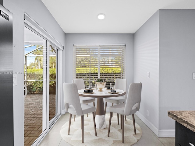 dining area with light tile patterned flooring