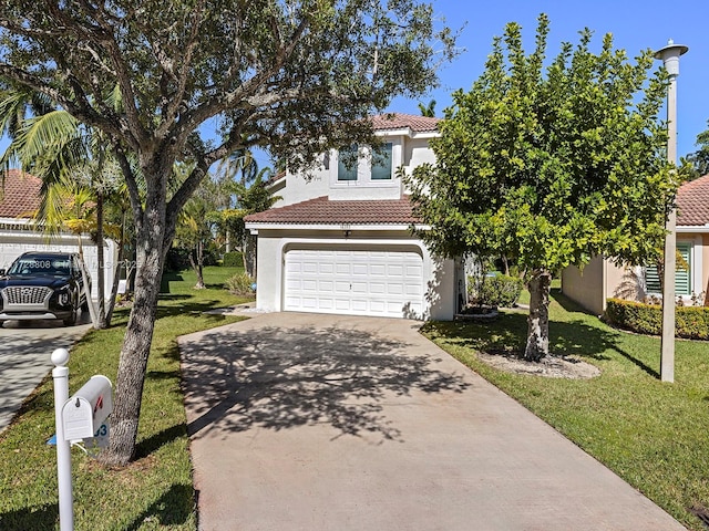 view of front facade featuring a garage and a front lawn