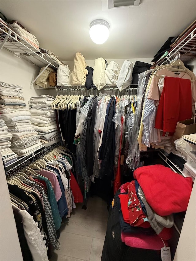 spacious closet with tile patterned flooring