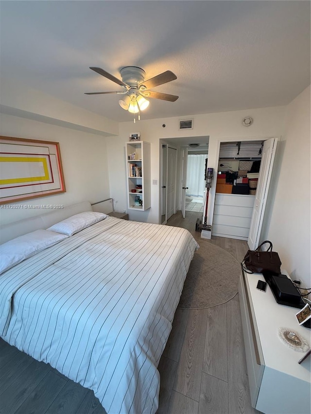 bedroom featuring a closet, ceiling fan, and hardwood / wood-style floors