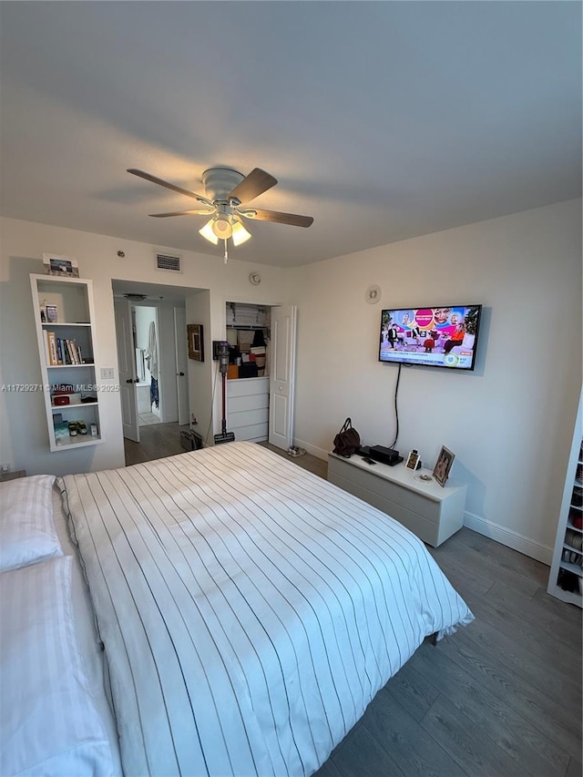 bedroom featuring ceiling fan and dark wood-type flooring