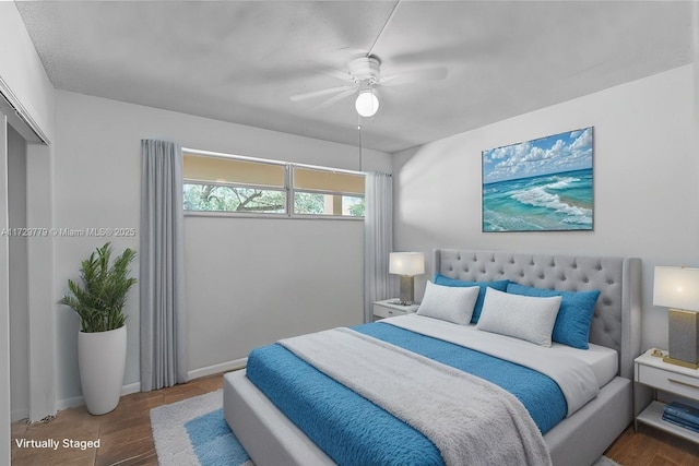 bedroom featuring dark hardwood / wood-style floors, a closet, and ceiling fan