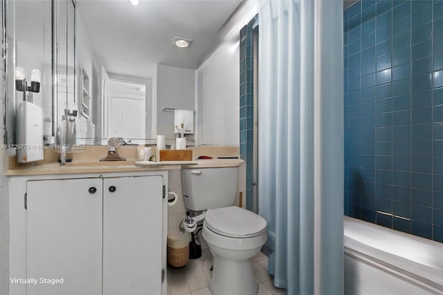 bathroom featuring tile patterned floors, vanity, and toilet