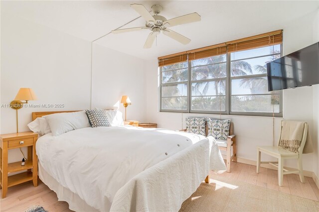 bedroom featuring ceiling fan and light hardwood / wood-style flooring