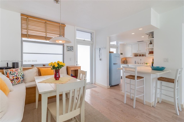 dining room featuring light hardwood / wood-style flooring