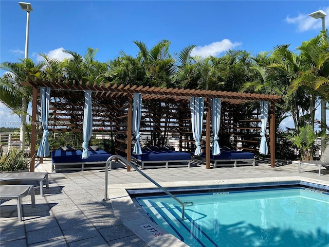 view of swimming pool with a pergola and a patio area