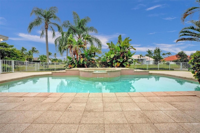 view of pool featuring an in ground hot tub