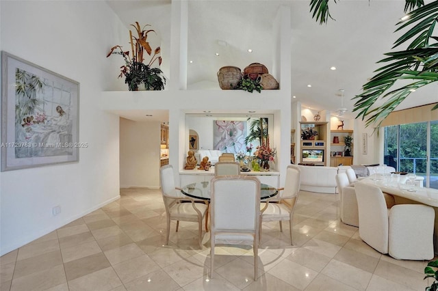 dining area featuring a high ceiling