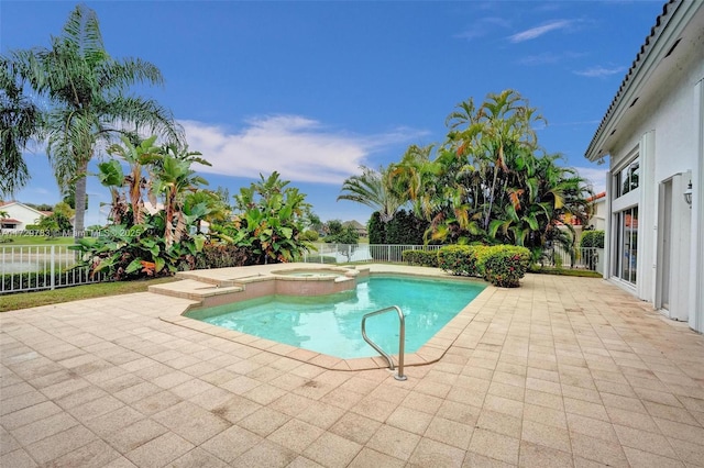 view of swimming pool with an in ground hot tub and a patio