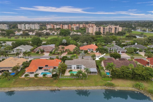 birds eye view of property featuring a water view