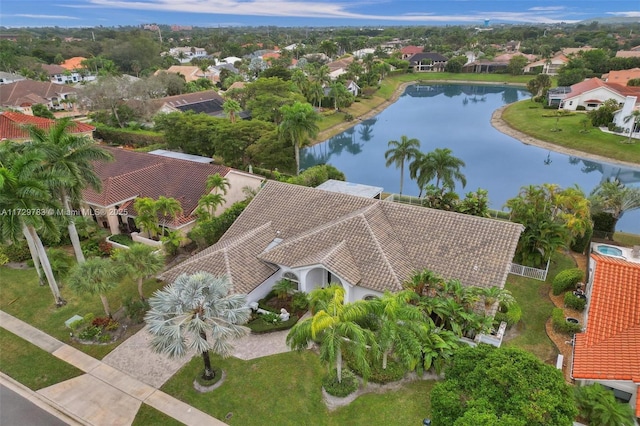 birds eye view of property featuring a water view