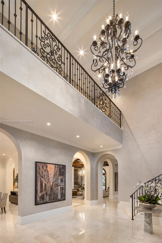 interior space featuring a high ceiling and crown molding