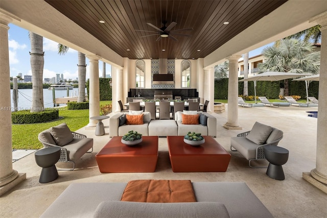 view of patio with ceiling fan, a water view, an outdoor hangout area, and area for grilling