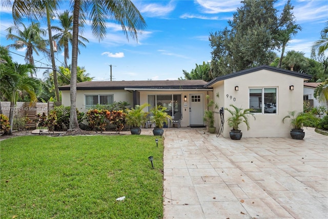 ranch-style house with a front yard