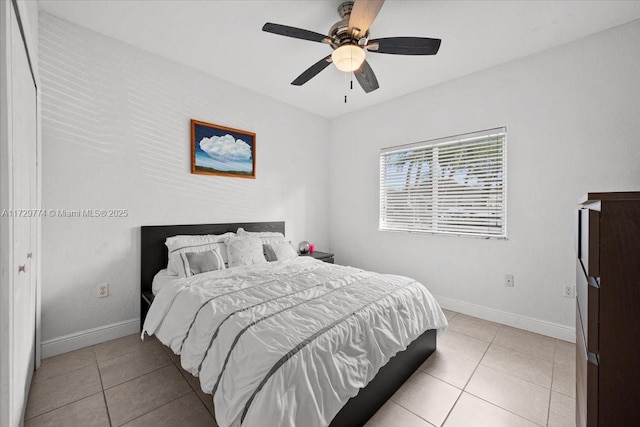 tiled bedroom with ceiling fan