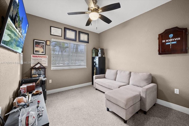 sitting room with carpet floors and ceiling fan