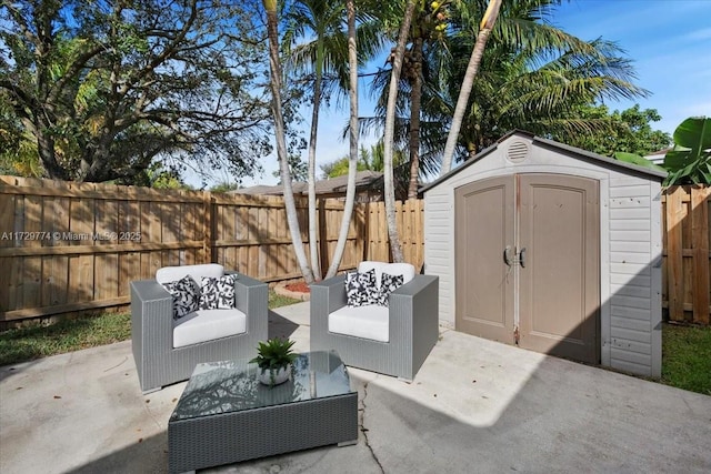 view of patio featuring a storage shed and an outdoor hangout area