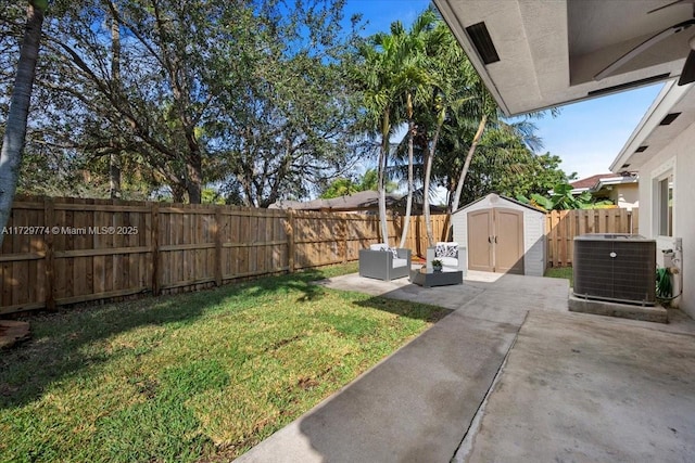 view of yard featuring an outdoor living space, cooling unit, a patio, and a shed