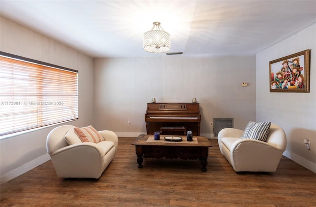 sitting room featuring dark wood-type flooring