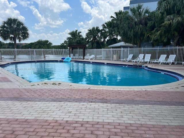 view of swimming pool featuring a patio area