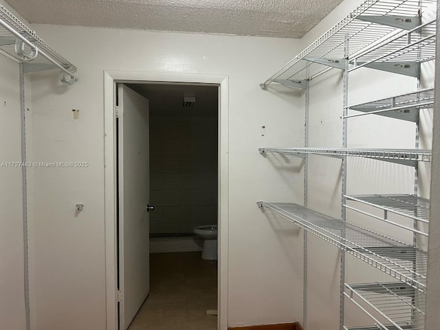 walk in closet featuring tile patterned floors